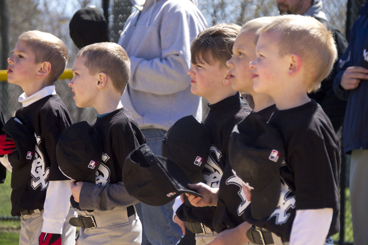 Little Leaguers took off their hats for the National Anthem. (Credit: Paul Squire)