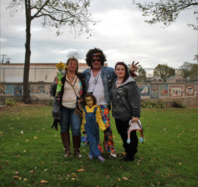 The Orlowski family of Port Jefferson Station checking on Melissa’s winning pumpkin in the Jack O’Lantern walk. Child: Harmony (dressed as minion), grandparents Denise and Dave (dressed as hippies) and Harmony’s mother Melissa.