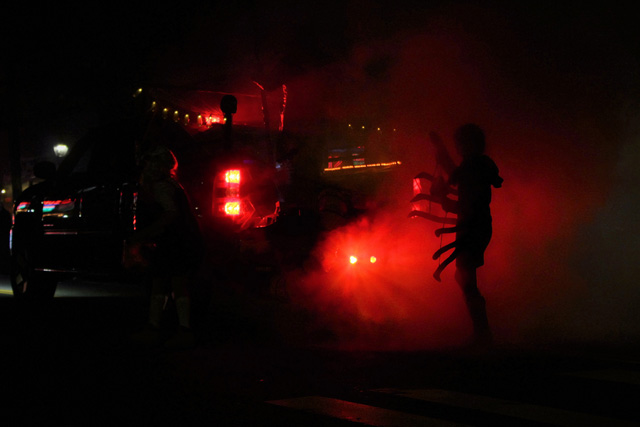 A frightening silhouette marches behind the fog machine
