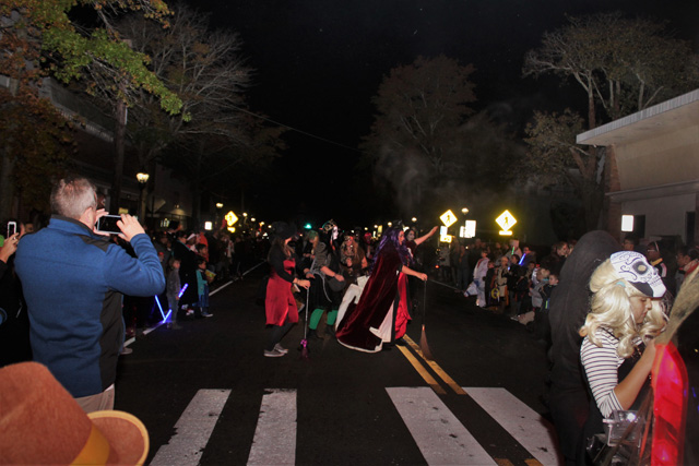 Diane Tucci and fellow Witch Doctors perform a ritualistic dance with their dancing sticks. 
