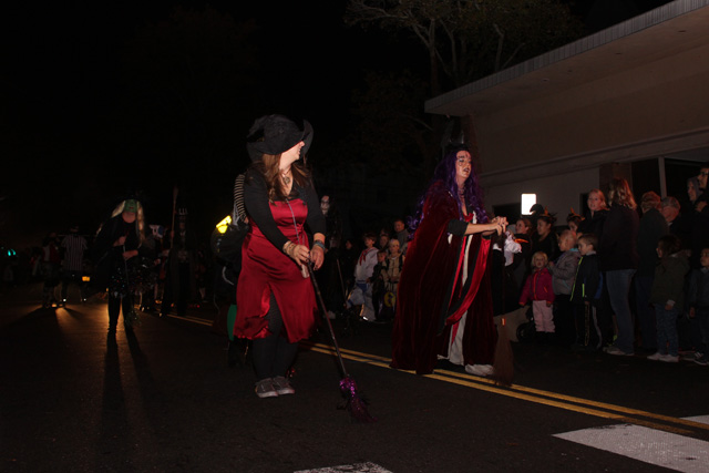 Diane Tucci and fellow Witch Doctors perform a ritualistic dance with their dancing sticks. 