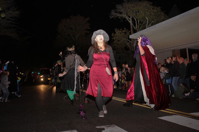 Diane Tucci and fellow Witch Doctors perform a ritualistic dance with their dancing sticks. 