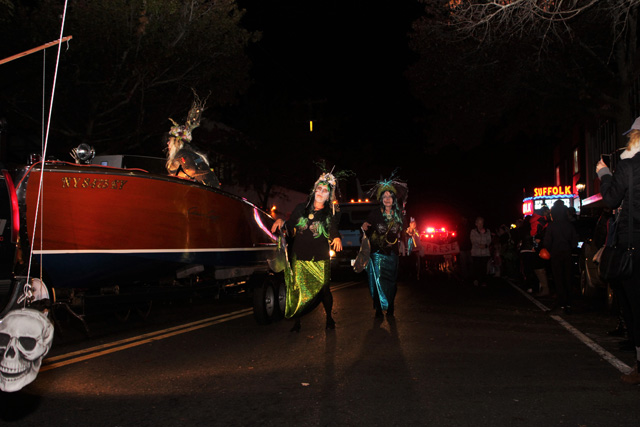 Zombie mermaids shuffling alongside the boat.