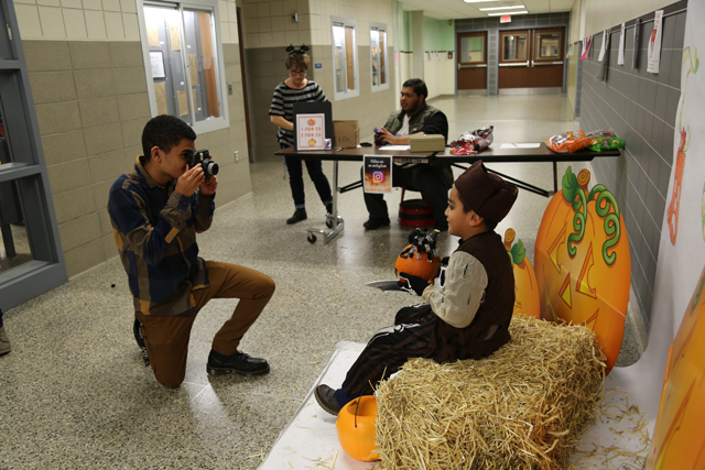 The Safe Halloween event featured activites set up by several Riverhead High School clubs, including the Photo Club's photo shoot on hay bales.