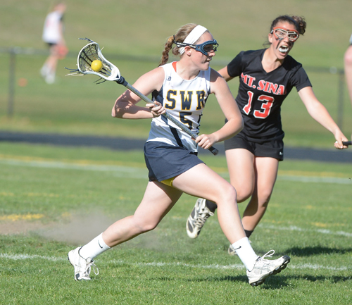 ROBERT O'ROURK PHOTO | Shoreham-Wading River junior Jessica Angerman leads the WIldcats against Mount Sinai today in the Class C championship game.