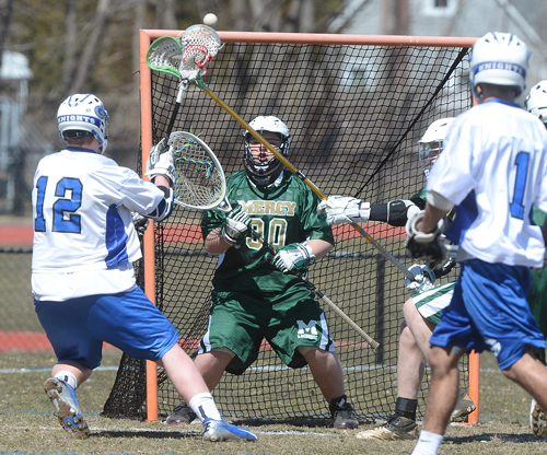 ROBERT O'ROURK PHOTO | Eddie Knight, who started in goal for Bishop McGann-Mercy, facing a shot by Elwood/John Glenn.