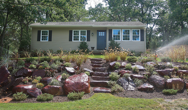 The finished landscape with boulders and plants on Industrial Bouvelard in Riverhead this week. (Credit: Barbaraellen Koch)