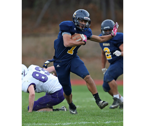 Shoreham-Wading River's Bryce Casey breaks through the line for a touchdown run against Port Jefferson. (Credit: Daniel De Mato)