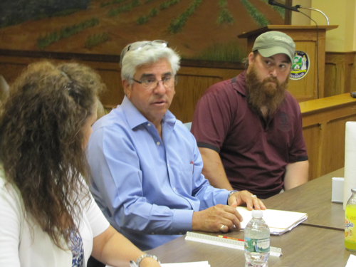 Bob Castaldi, owner of the Second Street firehouse building, and Paul Karlin, right, of Long Beard Brewing Co. address the Riverhead IDA Monday