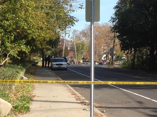 A crime scene investigation is underway on the North Side of West Main Street in Riverhead, west of the library. (Credit: Paul Squire)