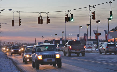 BARBARAELLEN KOCH PHOTO | The light at the Dick's Sporting Goods shopping center on Route 58 is maintained by the town, even though it's along a county road. 