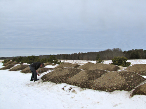Councilman George Gabrielsen inspecting the material at EPCAL. (Credit: Tim Gannon)