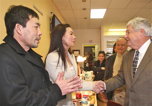 BARBARAELLEN KOCH PHOTO  |  Councilman John Dunleavy welcomes owner Rose Nyugen and her boyfriend Dan Tran to Polish Town Friday afternoon.
