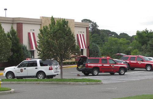 TGI Friday's in Riverhead TIM GANNON PHOTO | Fire marshals outside TGI Friday's Saturday morning.