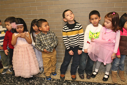BARBARALLEN KOCH PHOTO | The Southampton Head Start 3- and 4-year olds waited nervously in the hall outside Riverhead High School's auditorium for the show to start Friday evening.