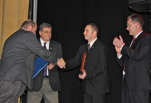 PAUL SQUIRE PHOTO | Officer John Morris (right) accepts his 'Cop of the Year' award at Friday night's dinner.