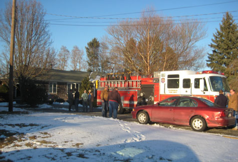 MICHAEL WHITE PHOTO | Firefighters at the scene of a chimney fire on Sound Avenue Wednesday.