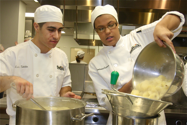 Luke Seldin of Bayport and Jordana Gaines of Holbrook preparing to rice the potatoes for mashed potatoes. (Credit: Barbaraellen Koch)