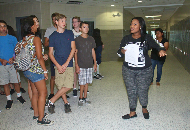 Junior Kamaria Harris gives a tour to a group of Freshmen in the new wing.