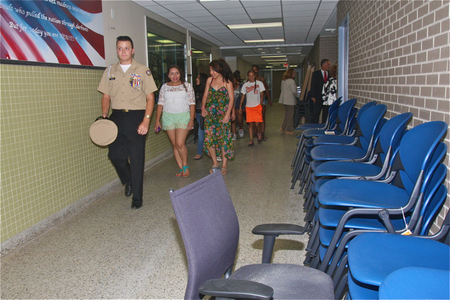 Senior ROTC cadet Nicholas leads a group of Freshmen on a tour in the wing by the old guidance offices.