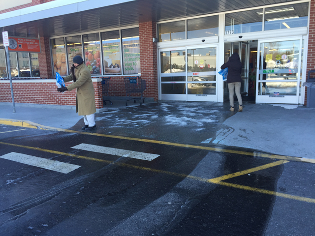 Aldi employees lay down salt after a burst pipe caused flooding at the Route 58 store on Sunday. (Credit: Grant Parpan)