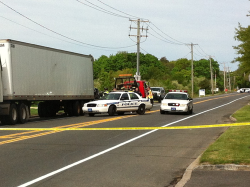 CARRIE MILLER PHOTO | Police investigate at the scene of a fatal car accident in Wading River Friday morning.