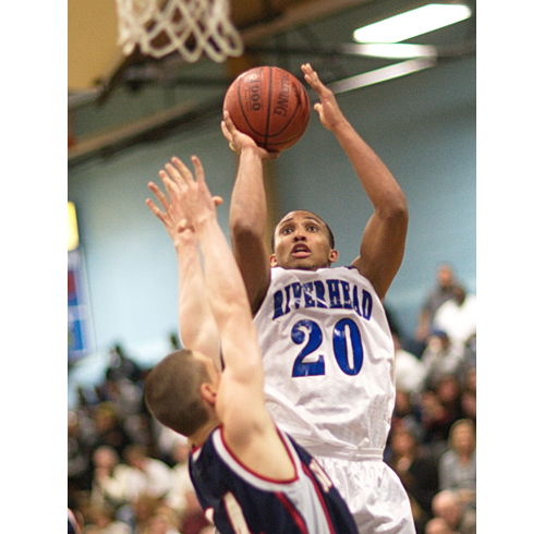 GARRET MEADE PHOTO | Riverhead junior Jeremiah Cheatom rises for a short jumper.