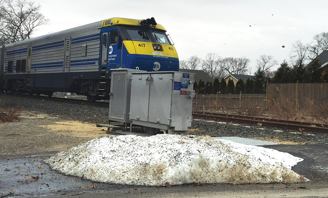 A Long Island Rail Road train crosses Factory Avenue in Mattituck en route from Riverhead to Greenport. (Credit: Grant Parpan)