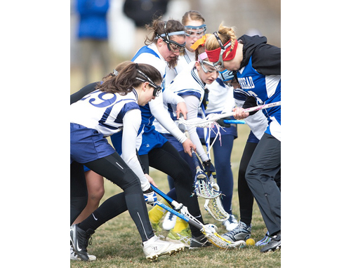 GARRET MEADE PHOTO | From left, Mattituck/Greenport/Southold's Tricia Brisotti, Riverhead's Carolyn Carrera, Mattituck/Greenport/Southold's Audrey Hoeg and Riverhead's Isabella LoPiccolo competing for a ground ball.