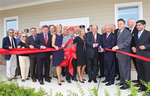 BARBARAELLEN KOCH PHOTO | PBMC Health board of directors president Sherry Patterson (center) and donors Jeffrey Feil (representing the Louis and Gertrude Feil Charitable Trust) and John Kanas cutting the ribbon Thursday afternoon.