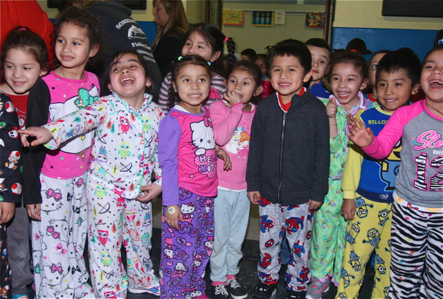 Kindergartners get a laugh at Mr. Payton all taped up. Barbaraellen Koch photo.