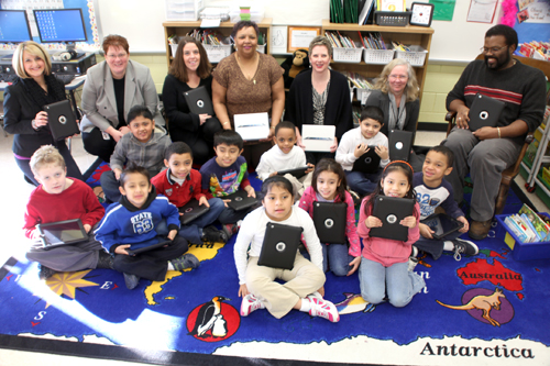 COURTESY PHOTO | Photo Captions: Ms. Siller's students with their new iPads. (Mrs. Siller next to Robert Hines, Director of Technology--far right)