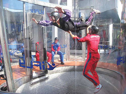 COURTESY PHOTO | People skydiving in a vertical wind tunnel. Skydive Long Island is looking to build a new indoor skydiving facility in Calverton.