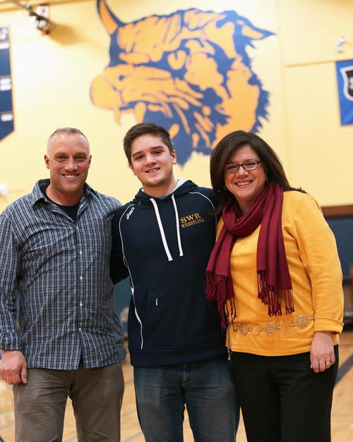 James Suarez with his parents Joe and Kalli on Senior Day at Shoreham-Wading River High School. (Credit: Garret Meade)
