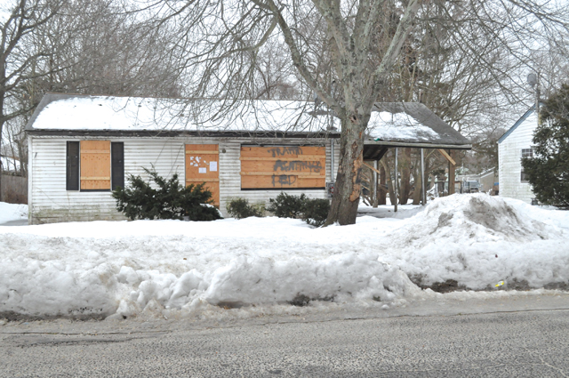 The house at 29 Lewis Street remains boarded up three months after the raid. (Credit: Grant Parpan)