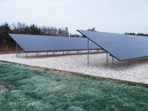 GREENLOGIC COURTESY FILE PHOTO | A ground-mounted solar array similar to one that was installed on Gabrielsen Farms' Aquebogue greenhouse.