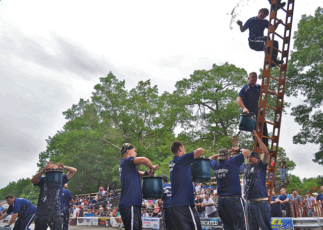 The bucket brigade event at the annual fire department drill competition in Riverhead. (Credit: Joseph Pinciaro)