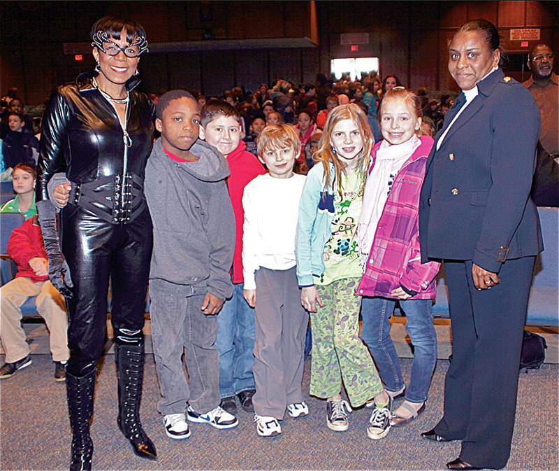 Felicia Wilson, left, and Det. Evelyn Hobson of the Riverhead Police Department with a group of fourth graders in 2011. (Credit: Felecia Lamb Wilson, courtesy)