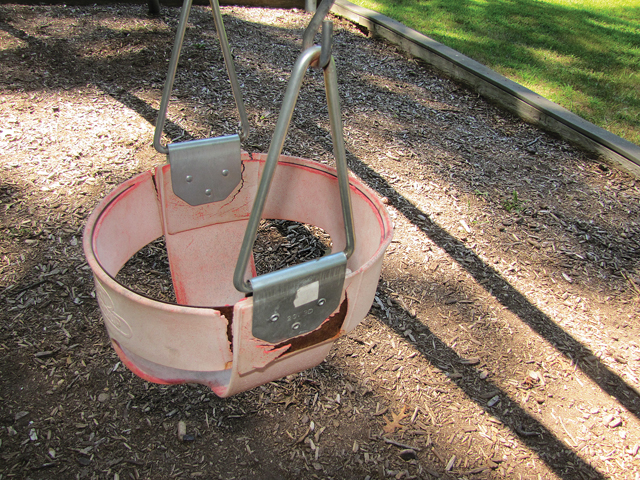 A broken swing at the park in Wading River. (Credit: Tim Gannon)