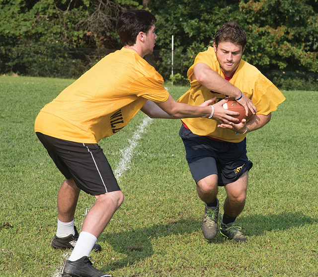 Shoreham-Wading River running back Chris Rosati takes a handoff. (Credit: Robert O'Rourk)