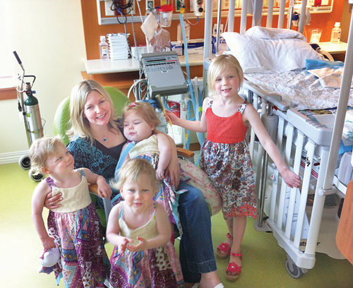 COURTESY PHOTO  |  Karen Serva with her 3-year-old triplets, Caroline (in her mother's arms), Abigail and Bridget, and 5-year-old daughter, Emily. The family traveled four hours round-trip during each visit to visit Caroline in Westchester County.