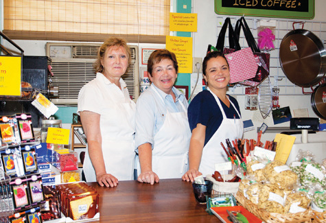 KATHARINE SCHROEDER PHOTO | Salamander's owner Claudia Helinski, center, with staff members Tracy Kom, left, and Adriana Mello.