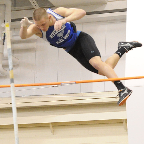 ROBERT O'ROURK PHOTO | Riverhead junior Dan Normoyle, one of three Blue Waves to pole vault 14 feet in the same meet, took first place in the Long Island Elite Track Invitational