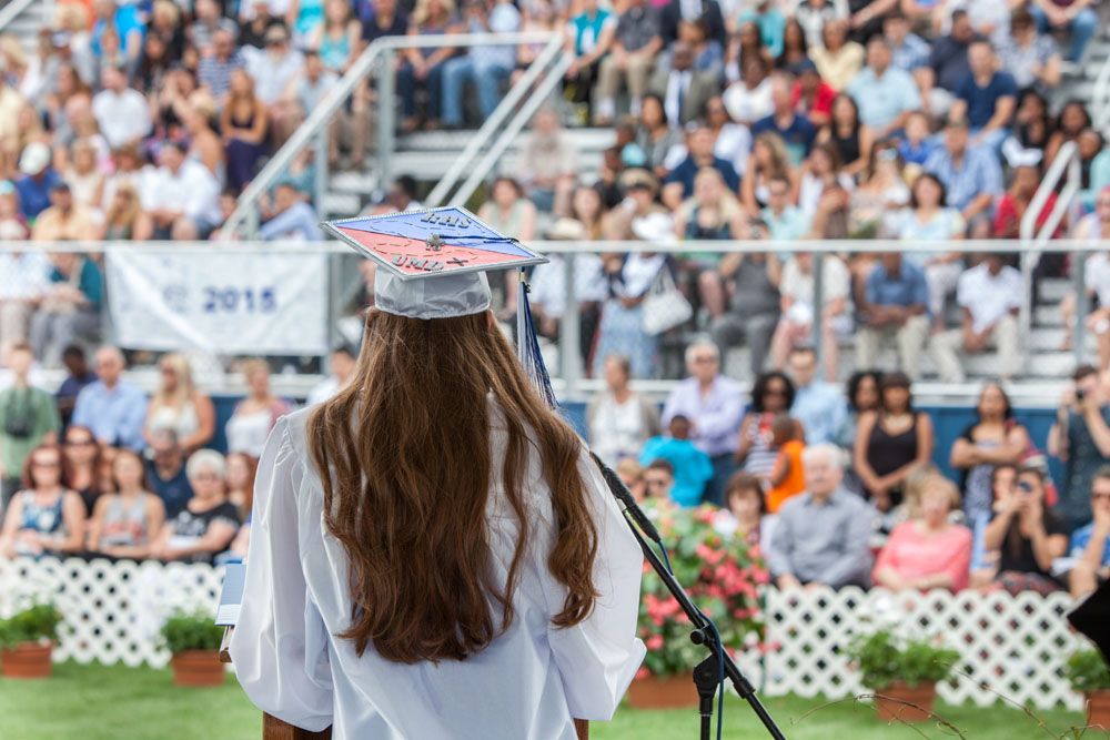 Mieko Vail, President of the class of 2015 faces the audience.