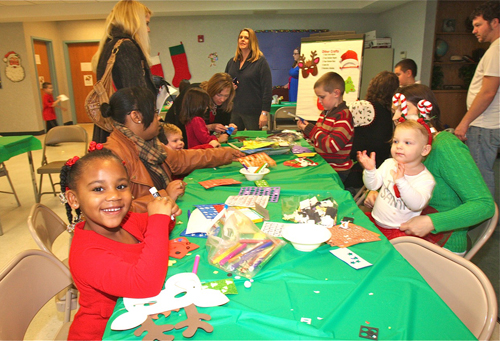Santa_RIV3 BARBARAELLEN KOCH PHOTO | Tymirah McCoy, 5, of Riverhead makes some holiday crafts.