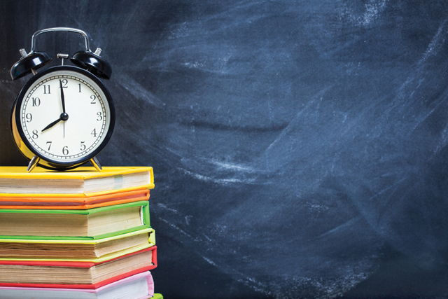 Stack of Books on A Desk
