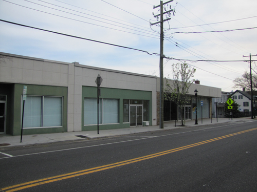 The Riverhead Landmarks Preservation Commission okays the demolition of the former Sears building and three adjacent downtown buildings Monday.