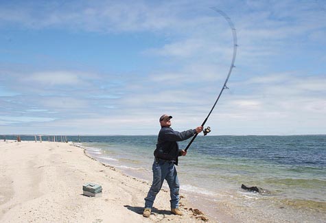 Surf_fishing BARBARAELLEN KOCH FILE PHOTO Surf fisherman at Iron Pier Beach on the Sound.