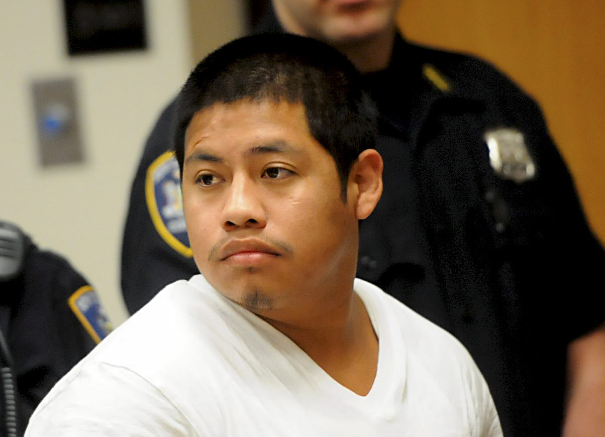 Guillermo Alvarado Ajcuc, inside Judge Toomey's courtroom next to a translator at Riverhead Criminal Court Tuesday morning where he was sentenced to 25-years to life for the rape and strangulation of Mirian Yohanna Garcia Mansilla. (Credit: James Carbone, Newsday)
