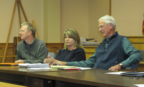 From left, Landmarks Preservation Commission member  Cliff Baldwin, Riverhead Town Councilwoman Jodi Giglio and commission chair Richard Wines listen to speakers at Monday's commission meeting, where a proposal to make a six-mile stretch of Main Road a National Register Historic Place was withdrawn. (Credit: Tim Gannon)
